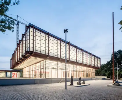 Modern building of Belvedere 21 museum with water canal in front