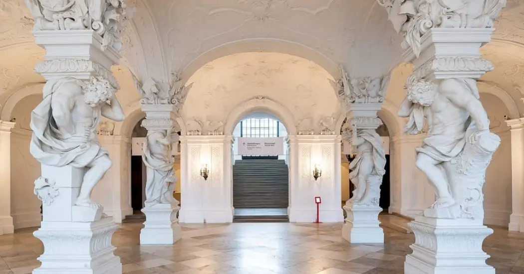 Art gallery inside Belvedere Palace with classic sculptures on white walls