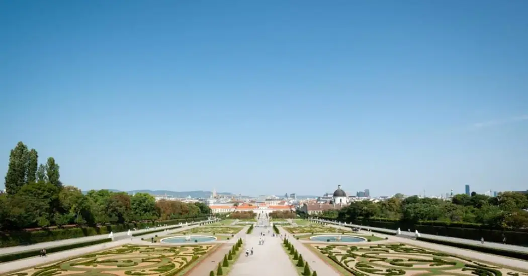 Pathway leading to the entrance of Lower Belvedere with gardens on both sides.