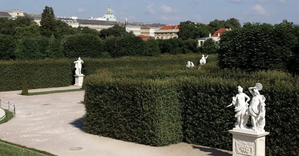 Statues and tall green hedges in the Belvedere Gardens.