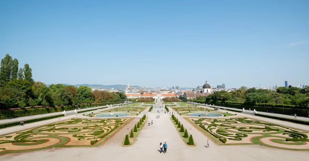 Pathway leading to the entrance of Lower Belvedere with gardens on both sides.