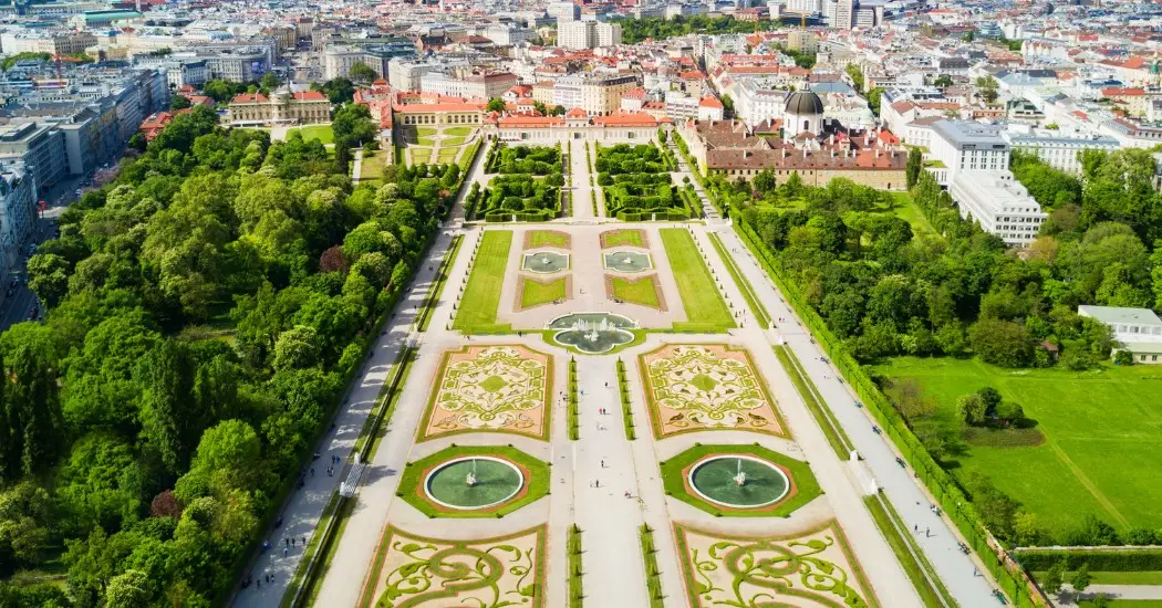 A straight garden path with fountains leading to the palace. A straight garden path with fountains leading to the palace.
