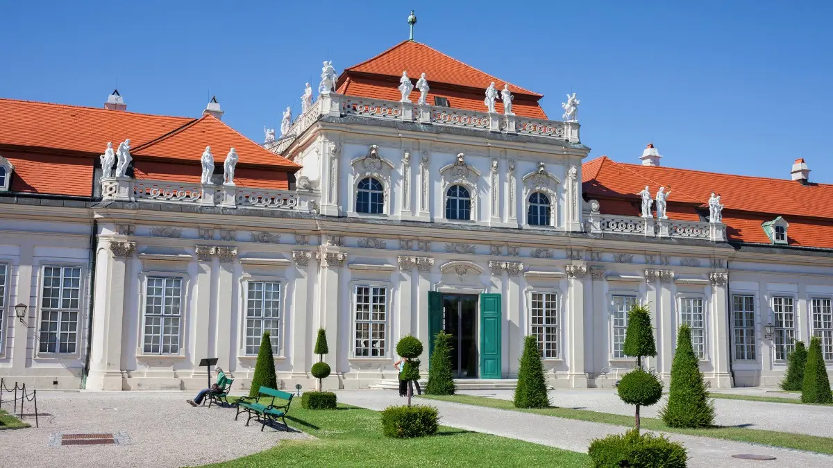 Entrance of the Lower Belvedere with white statues and red roof. Entrance of the Lower Belvedere with white statues and red roof.